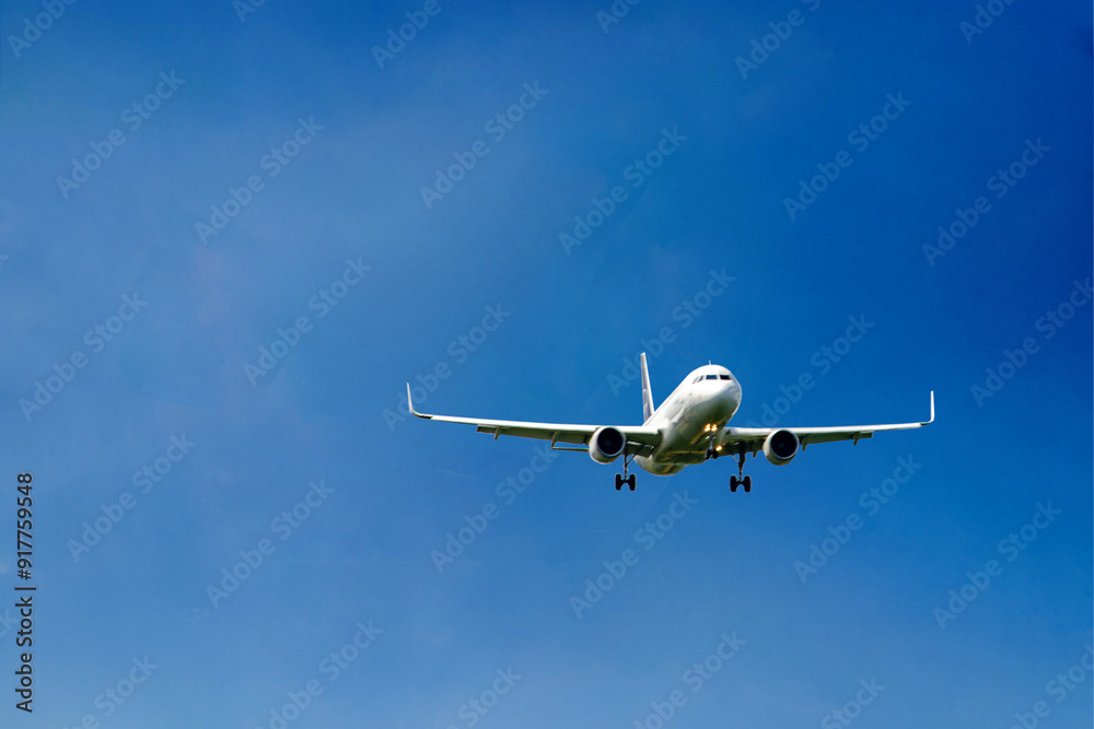 White passenger airplane flying in the sky amazing clouds in the background White passenger airplane flying in the sky amazing clouds in the background