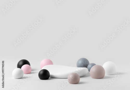 Product Presentation Scene in Minimalist Geometric Composition: Soft Bubble Spheres and White Stone Pedestal in Pastel Shades on White Background. Studio photography.