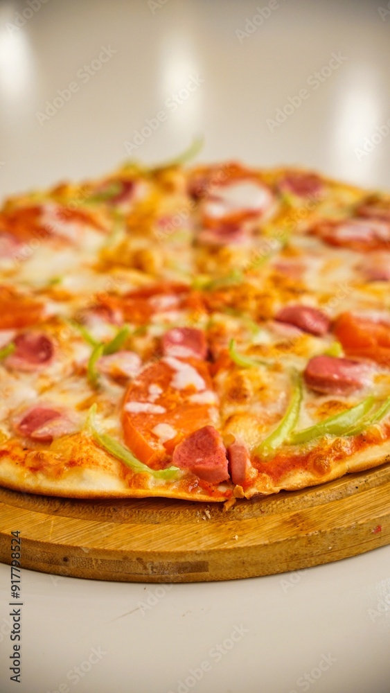 Pizza With Sausage, Peppers, and Tomatoes on Wooden Board Pizza With Sausage, Peppers, and Tomatoes on Wooden Board