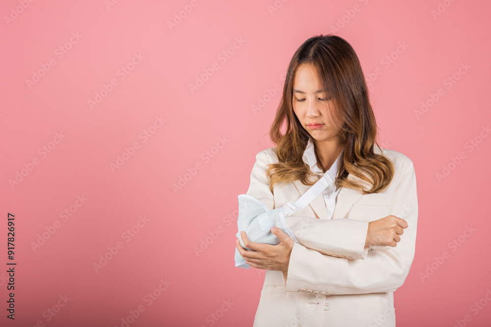 Arm broken. Unhappy business woman confident smiling broken arm after accident and wear arm splint for treatment, Asian female sling support hand studio isolated on white background, copy space Arm broken. Unhappy business woman confident smiling broken arm after accident and wear arm splint for treatment, Asian female sling support hand studio isolated on white background, copy space