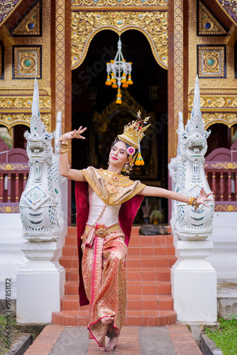 The beautiful performance shows Asian pretty women wearing traditional dress costumes in the Ramakien story of ancient in the past of Thai literature at famous temple in Chiang Mai Thailand. photo