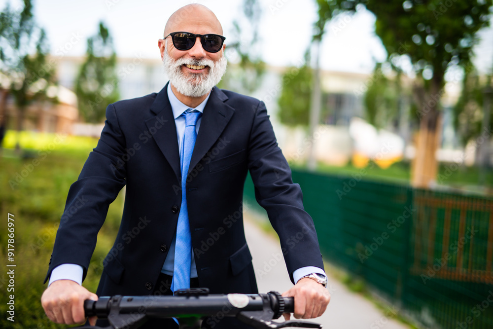 Senior businessman riding electric scooter wearing suit in the city Senior businessman riding electric scooter wearing suit in the city