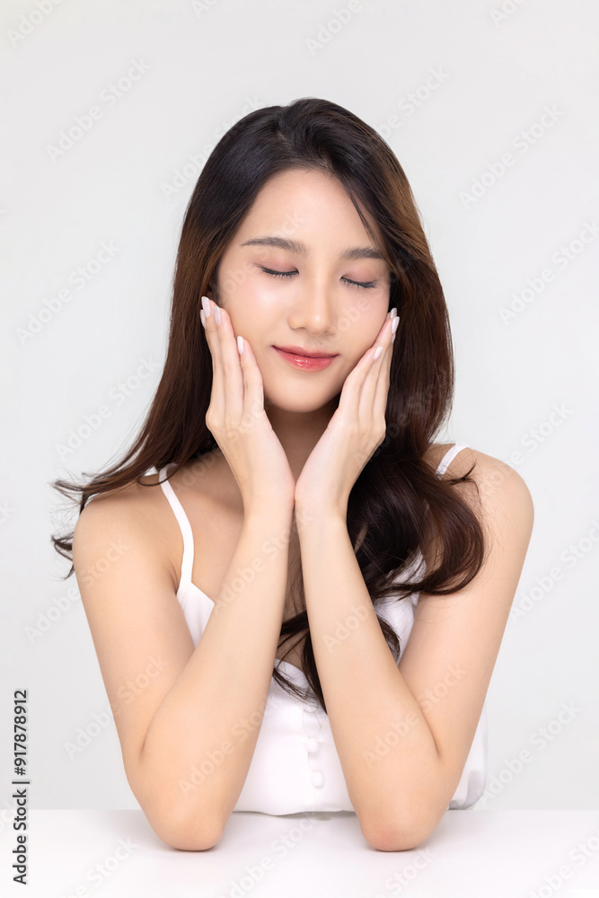 Beautiful young Asian woman with natural beauty make up style shows healthy and perfect skin on isolated background. Facial and skin care concept for commercial advertising. Beautiful young Asian woman with natural beauty make up style shows healthy and perfect skin on isolated background. Facial and skin care concept for commercial advertising.