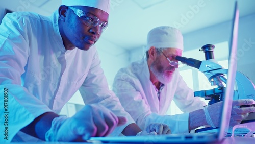 Research Chemists Analyzing Data in Innovative Laboratory With Advanced Equipment