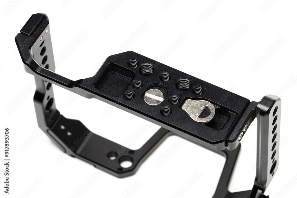 under side of camera cage. showing quarter inch screw and holes with magnetically attached key. Standard arca swiss QR plate bottom. under side of camera cage. showing quarter inch screw and holes with magnetically attached key. Standard arca swiss QR plate bottom.