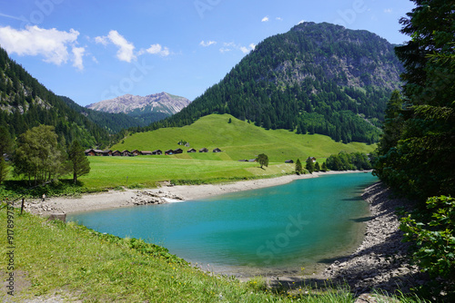 Bild auf Leinwand Blick auf den kleinen Stausee in Steg in Liechtenstein im Sommer