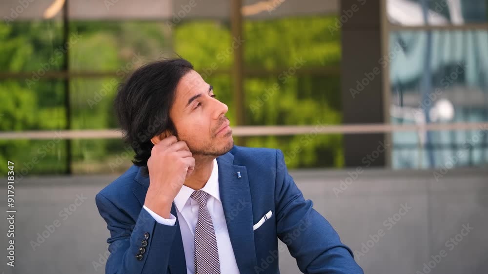 Indian businessman in a suit pensive. He is deep in thought, possibly working on a project or making a decision. Concept of focus and concentration Indian businessman in a suit pensive. He is deep in thought, possibly working on a project or making a decision. Concept of focus and concentration