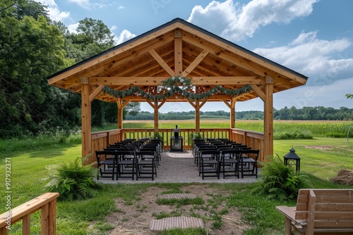 Classic luxury wedding setup with wooden chairs and a macrame backdrop under a rustic barn