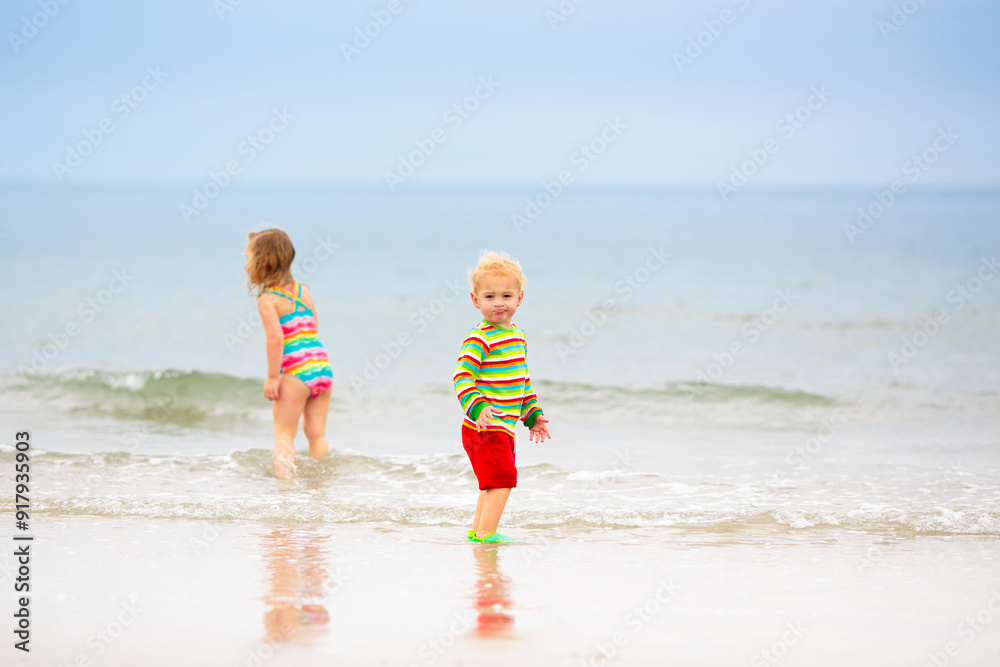 Kids playing on beach. Children play at sea. Kids playing on beach. Children play at sea.