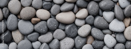 Arrangement of Smooth Gray Pebbles in Various Shades 