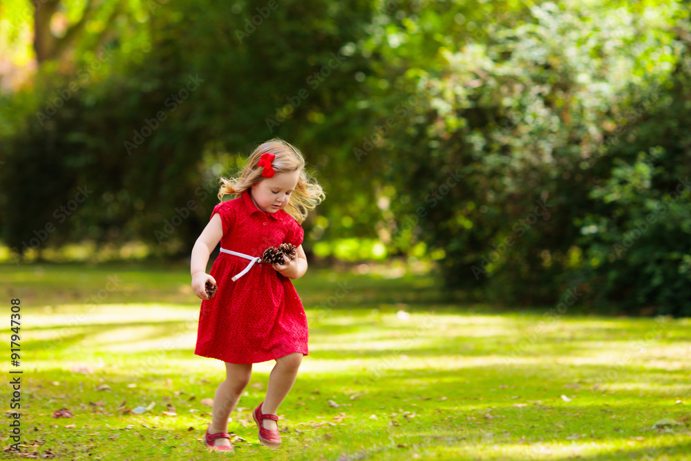 Child in fall park. Kid with autumn leaves. Child in fall park. Kid with autumn leaves.