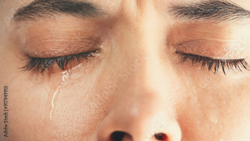 Close-up shot of young crying woman	
 photo
