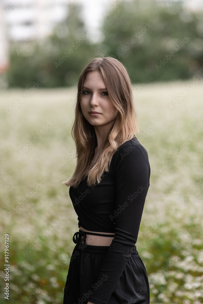 Portrait of a young beautiful long-haired girl in nature. Portrait of a young beautiful long-haired girl in nature.