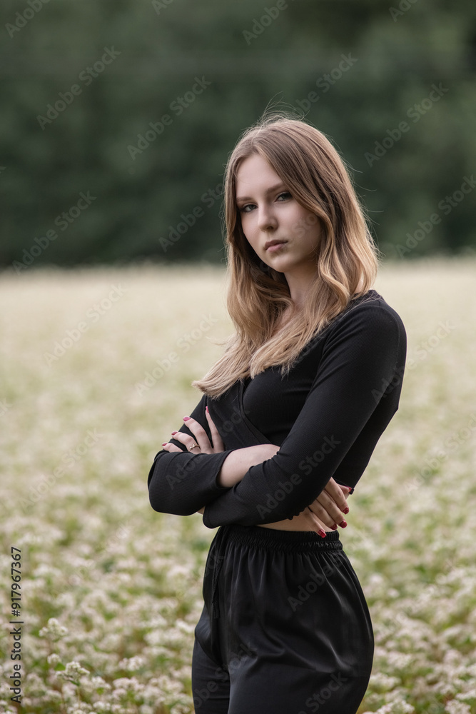 Portrait of a young beautiful long-haired girl in nature. Portrait of a young beautiful long-haired girl in nature.