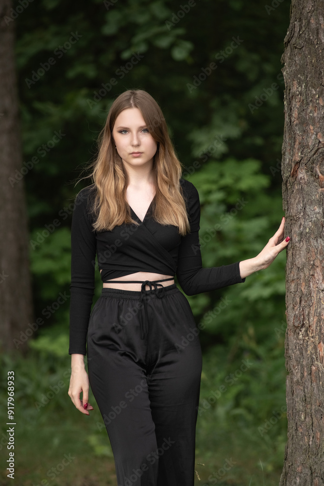 Portrait of a young beautiful long-haired girl in nature. Portrait of a young beautiful long-haired girl in nature.