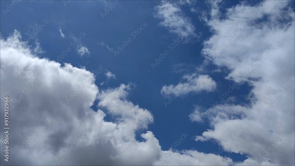 Strange and curious little ball clouds moving at midday Strange and curious little ball clouds moving at midday