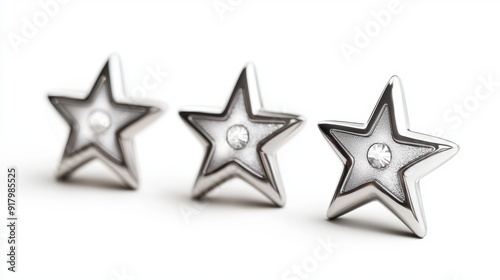 three silver stars with diamonds on them