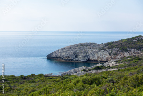 Amazing rocky formations and gorgeous sea waters of the south coastline in Othonoi island, Greece photo