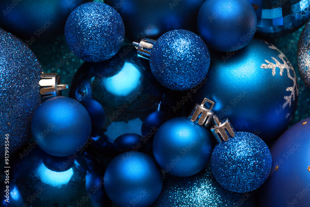 Background with blue Christmas balls..Close-up of a pile of blue Christmas balls, different sizes, shades and textures. Flat lay
