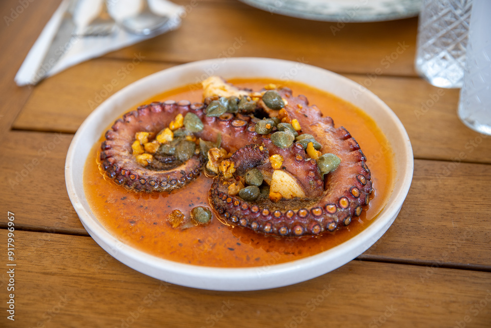 dish with octopus on the restaurant table dish with octopus on the restaurant table