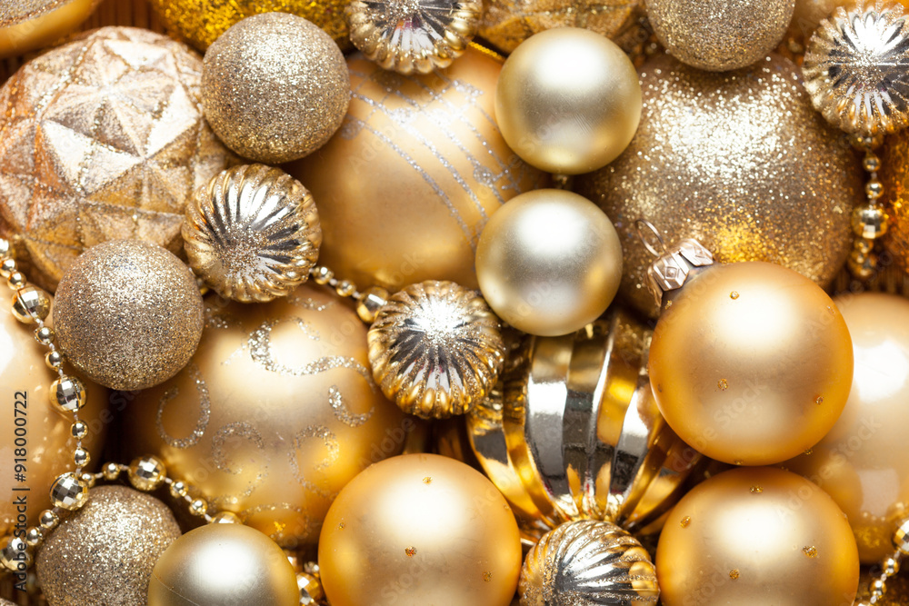 Christmas and New Year background with holiday decorations. Close up of pile golden Christmas balls,various size. Flat lay