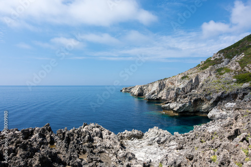 Amazing rocky formations and gorgeous sea waters of the south coastline in Othonoi island, Greece photo