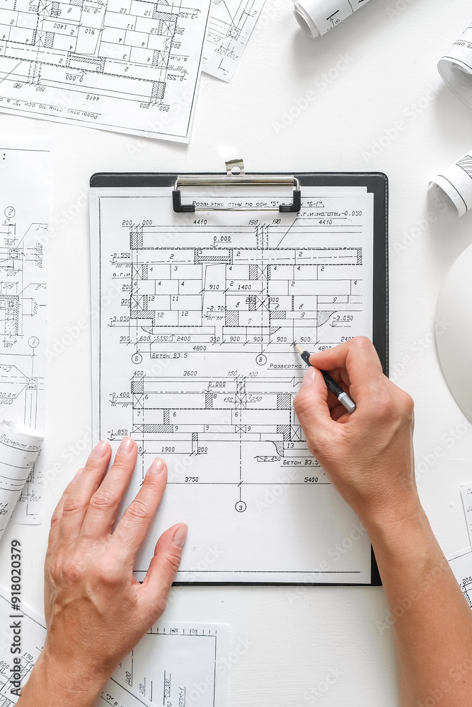 Architects concept, engineer architect designer freelance work on start-up project drawing, construction plan. architect design working drawing sketch plans blueprints and making construction model Architects concept, engineer architect designer freelance work on start-up project drawing, construction plan. architect design working drawing sketch plans blueprints and making construction model