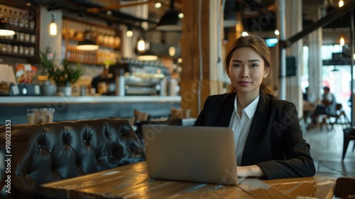 The businesswoman in the cafe.