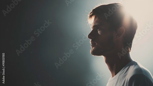 Male Profile in Dramatic Lighting During a Contemplative Moment