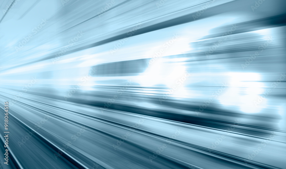 Blue high speed train runs on rail tracks - The train is going too fast as a result the air pressure is causing too much heat at the front Blue high speed train runs on rail tracks - The train is going too fast as a result the air pressure is causing too much heat at the front