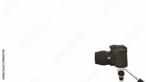 3D rendering of a camera on a tripod with a plain white background. Suitable to place on content with that theme. photo