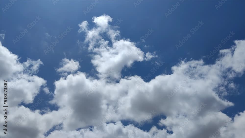 Bright cumulus clouds moving across the sky Bright cumulus clouds moving across the sky