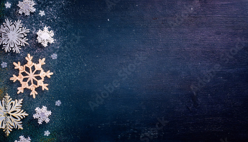 A set of snow crystals against a dark chalkboard b photo