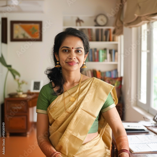 Indian female teacher sitting confidently at office or classroom