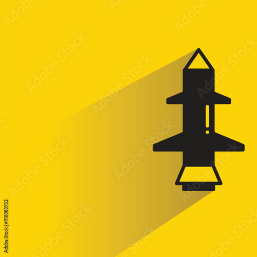 missile icon with shadow on yellow background
