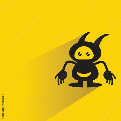 alien monster character with shadow on yellow background