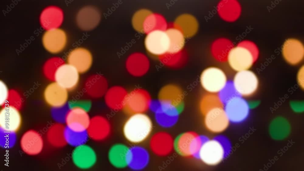 Christmas tree garland. Yellow, green, red and green lights. Defocused image, bokeh effect. Seamless looping Christmas tree garland. Yellow, green, red and green lights. Defocused image, bokeh effect. Seamless looping