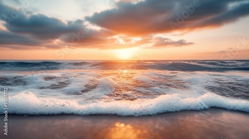 A serene depiction of a sunset over ocean waves, creating a tranquil and calming atmosphere, with clouds scattered in the sky, capturing the peaceful essence of the seashore.