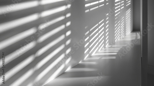 Abstract gray and light blur on white wall from window shadows; indoor architecture stripe shadows, monochrome shadow overlay effect