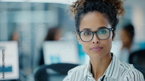 Smiling Young Woman in Glasses Holding Phone at Indoor Festival During Evening