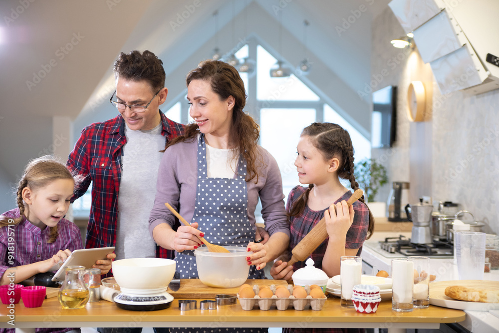 Family cooking in the kitchen at home