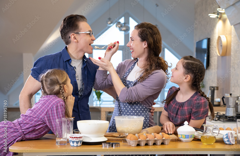 Family cooking in the kitchen at home