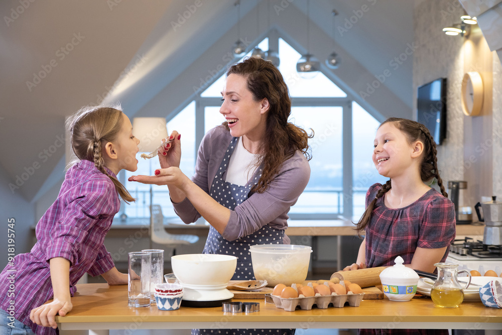 Family cooking in the kitchen at home