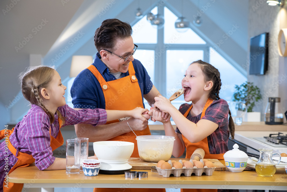 Family cooking in the kitchen at home