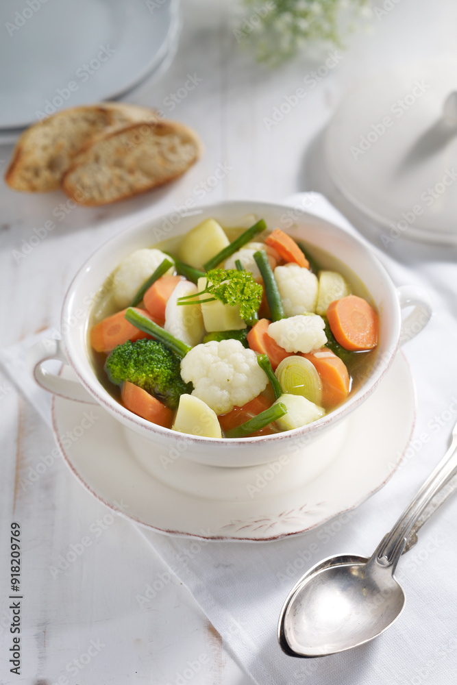 Homemade Vegetable Soup with Fresh Ingredients in a Rustic Setting Homemade Vegetable Soup with Fresh Ingredients in a Rustic Setting