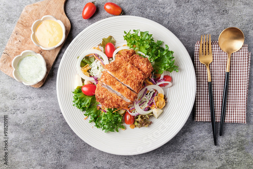 Salad with fried breaded pork A healthy and delicious dish with protein and nutrients from various vegetables, served with mayonnaise and sour sauce. photo