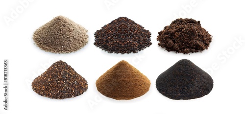 Six different types of soil isolated on a white background. The soil samples are arranged in a row, with the lightest soil on the left and the darkest soil on the right. 