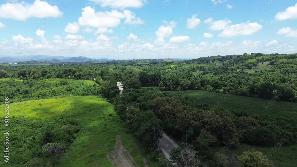 Long and narrow road cemented on the rugged terrain of a forested mountain in the Cordilleras. Drone aerial Long and narrow road cemented on the rugged terrain of a forested mountain in the Cordilleras. Drone aerial