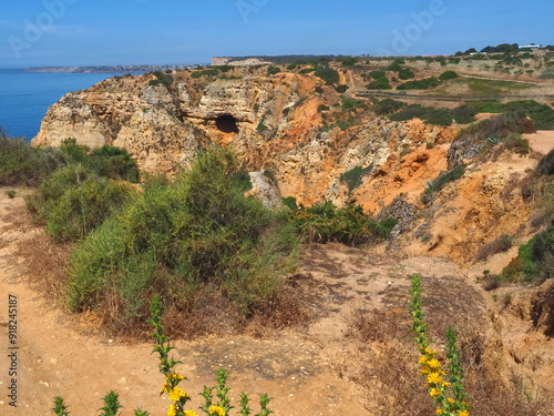 Algarve coast of Portugal between Ponta da Piedade and beach Praia Porto de Mos in Lagos with epic cliffs and nature photo