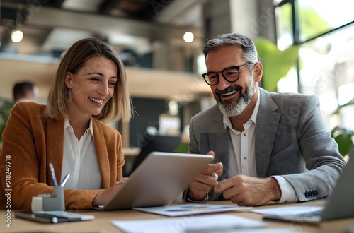 business man and woman team using tablet working together in office